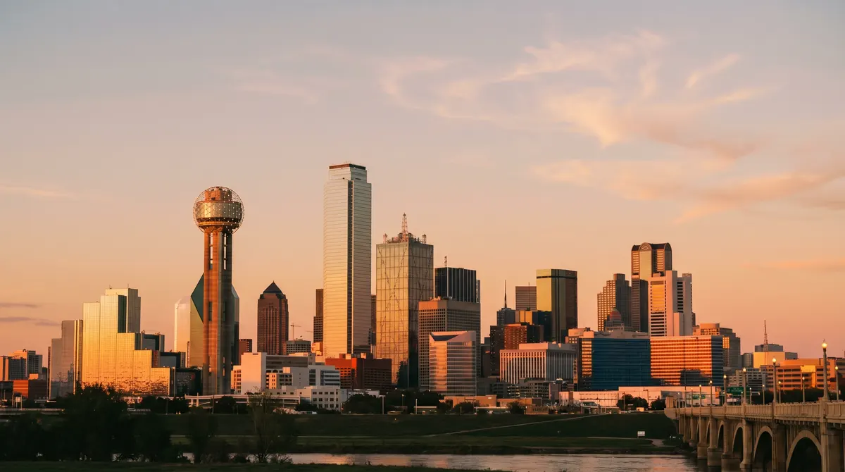 Dallas skyline at sunset with Reunion Tower and downtown buildings