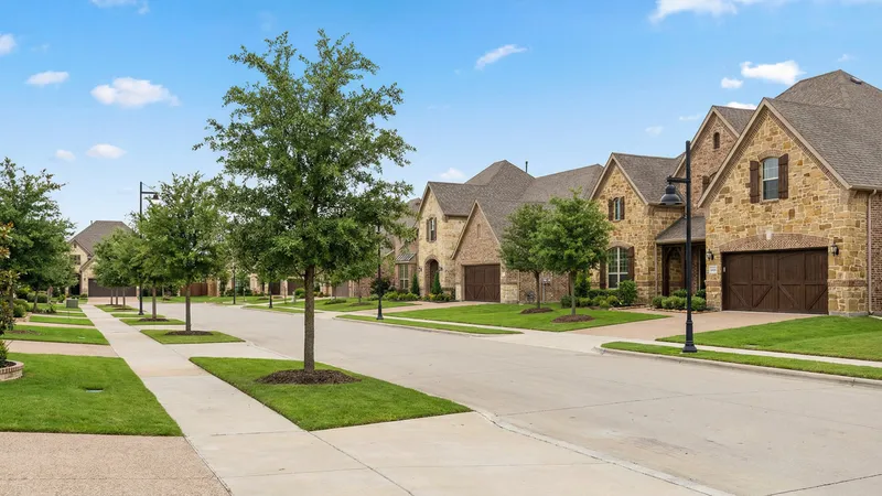 Suburban neighborhood in Frisco Texas with new construction homes and tree-lined streets