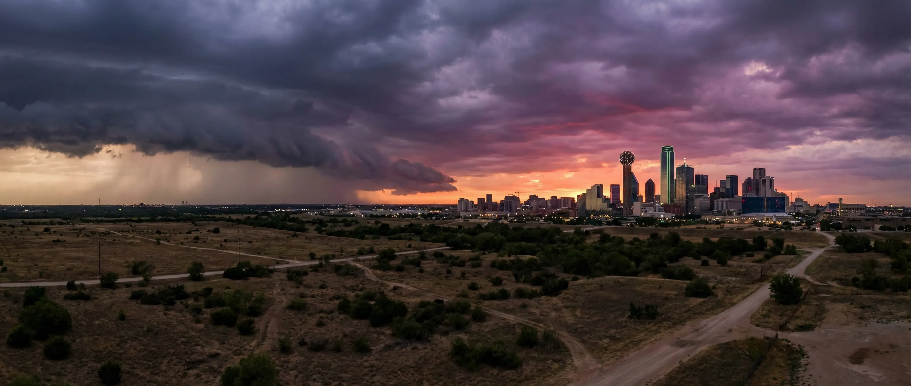 Dallas skyline with dramatic storm clouds at sunset